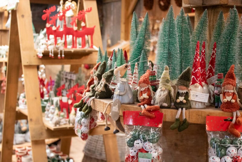 Close up of a wooden shelf wiht many christmas decorations