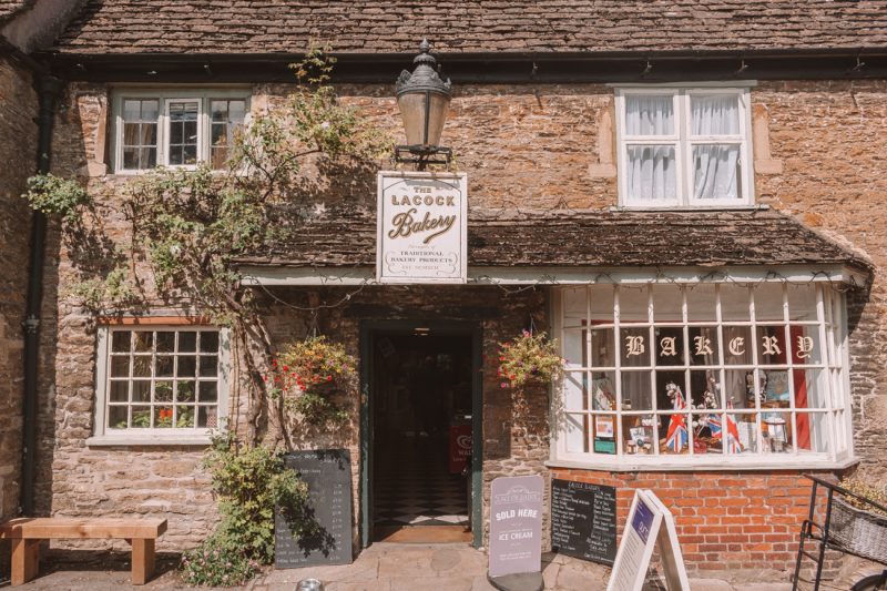 Exterior of Lacock Bakery, a small stone cottage with grey slate roof in Lacock southern England