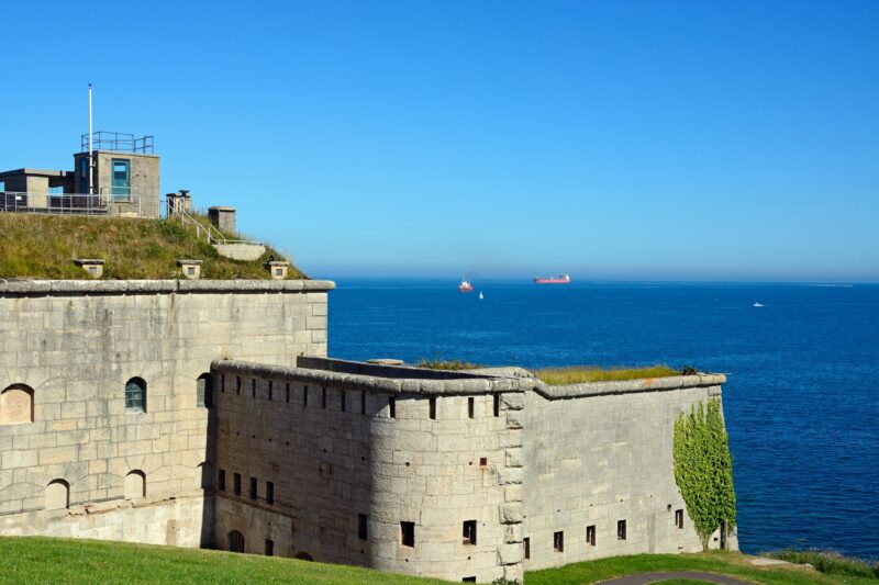 Exterior of Nothe Fort with grey stone walls and views out to sea